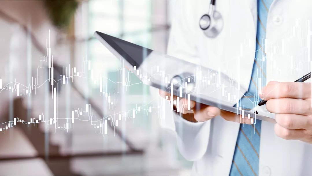 A doctor is using a tablet to analyze healthcare data graphs. The image highlights the integration of technology in medical analysis, showcasing the modern tools used in healthcare data assessment.