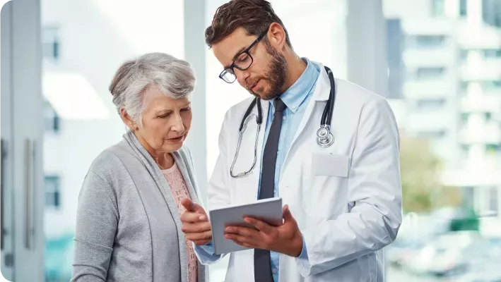 Doctor talks to an elderly patient